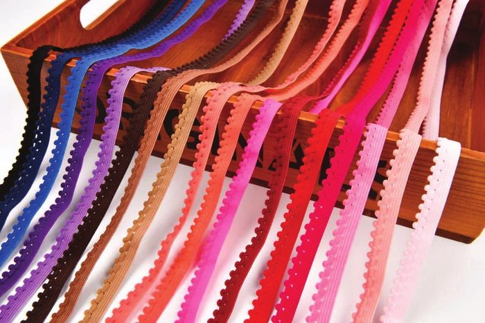 Woven elastic flat rolls stacked